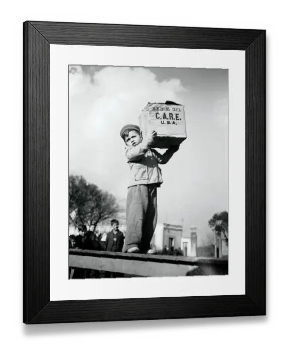 Framed Print : Child Carrying C.A.R.E. Package In Rome Framed Print : Child Carrying C.A.R.E. Package In Rome