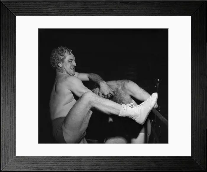 Framed Print : George Wrestling in Action