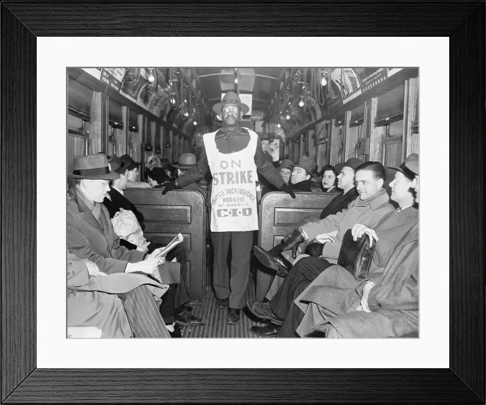 Framed Print : Picketer with Sign Walks Through Transit Car Framed Print : Picketer with Sign Walks Through Transit Car