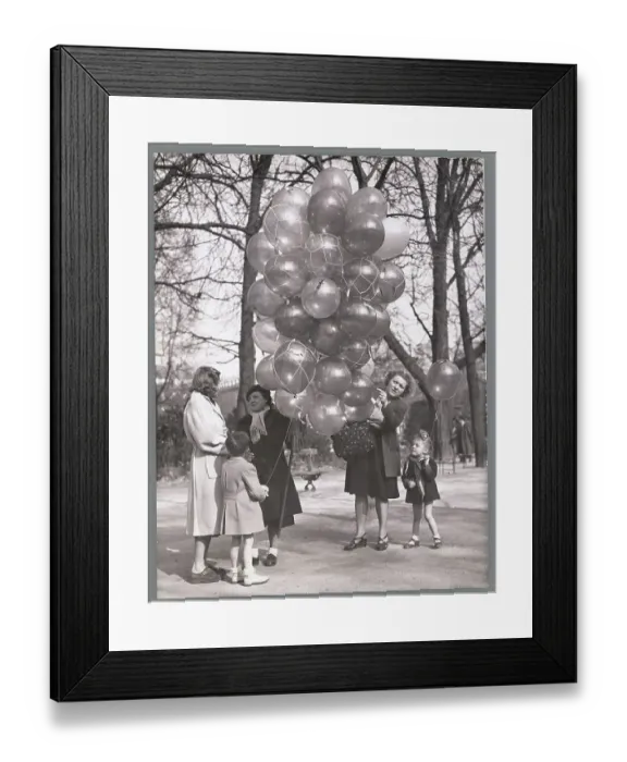 Framed Print : Mothers with Their Children Buying Balloons in the Park Framed Print : Mothers with Their Children Buying Balloons in the Park