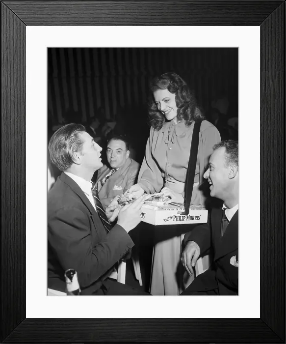 Framed Print : Robert Mitchum Buys from Cigarette Girl Framed Print : Robert Mitchum Buys from Cigarette Girl