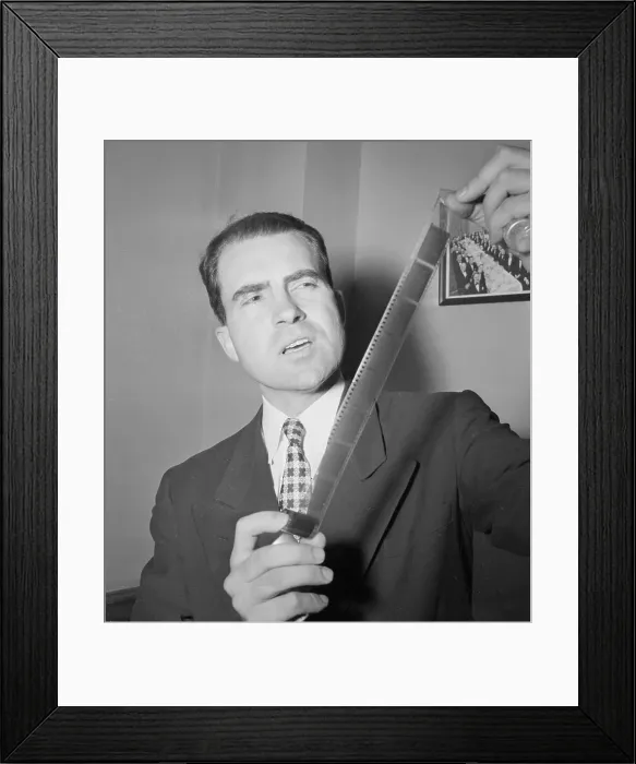 Framed Print : Congressional Representative Richard Nixon Holding Microfilm Strips Framed Print : Congressional Representative Richard Nixon Holding Microfilm Strips