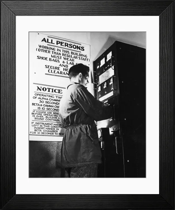 Framed Print : Man Using a Geiger Counter to Check for Radioactive Particles Framed Print : Man Using a Geiger Counter to Check for Radioactive Particles