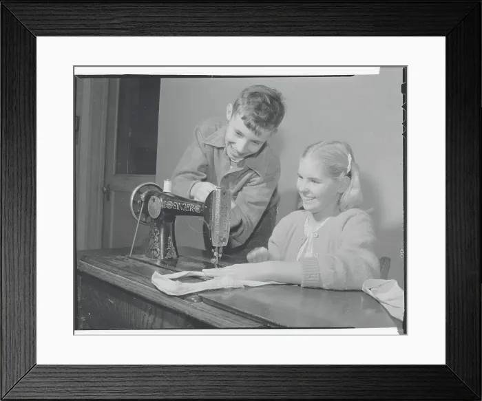 Framed Print : Students Practicing Sewing Framed Print : Students Practicing Sewing