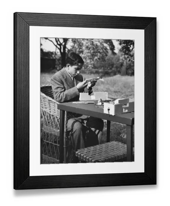 Framed Print : King Faisal II Builds Model Airplane Framed Print : King Faisal II Builds Model Airplane