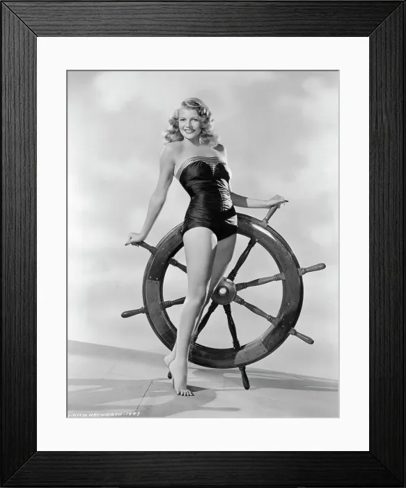 Framed Print : Rita Hayworth and Ship's Wheel Framed Print : Rita Hayworth and Ship's Wheel