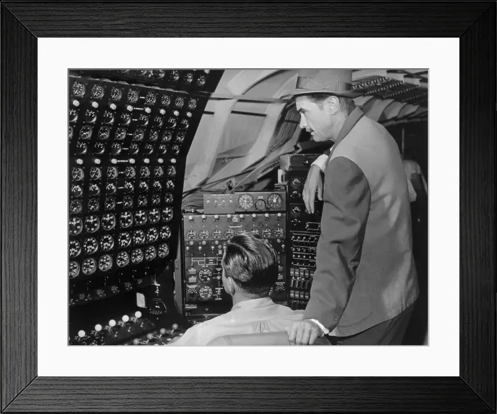 Framed Print : Howard Hughes Checking Dials in His Flying Boat
