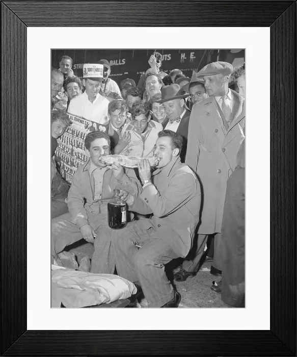 Framed Print : Spectators Watching Two Men Eating a Sandwich Framed Print : Spectators Watching Two Men Eating a Sandwich