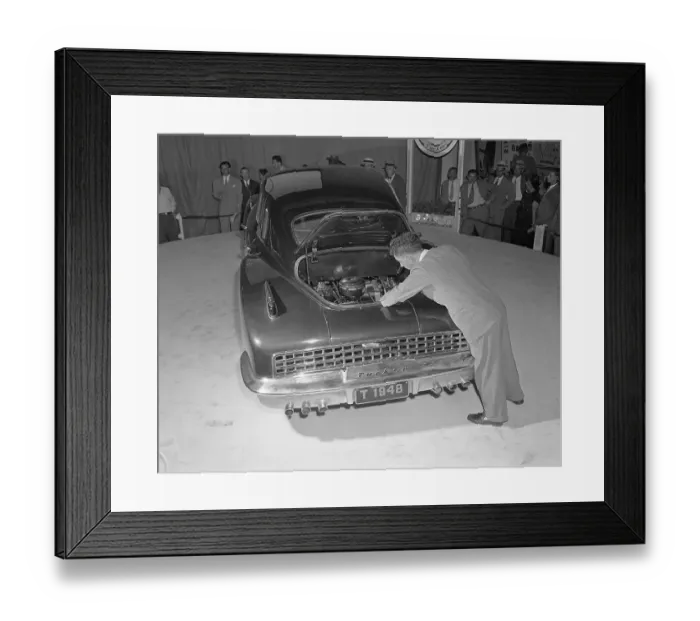Framed Print : Man Looks at Engine in Tucker Car