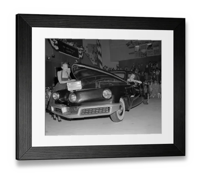 Framed Print : Model Putting Handbag in Front Trunk of Car Framed Print : Model Putting Handbag in Front Trunk of Car