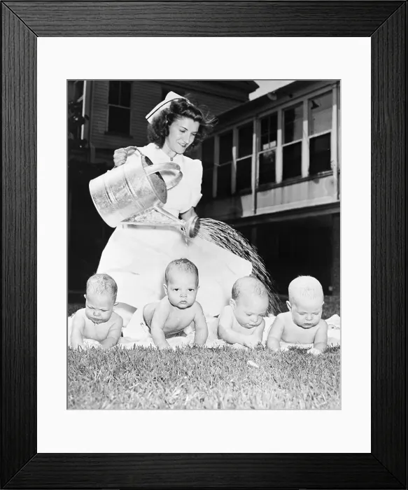 Framed Print : Nurse Watering Quadruplet Babies Framed Print : Nurse Watering Quadruplet Babies