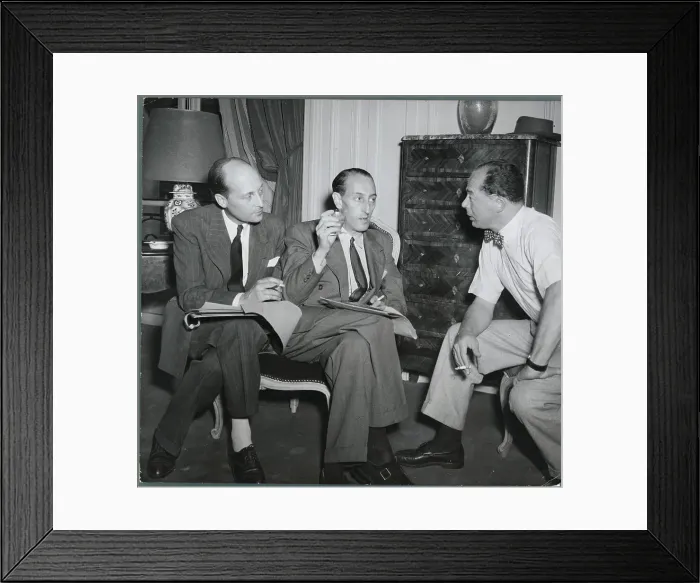 Framed Print : Film Producer Billy Wilder and Associates Conversing Framed Print : Film Producer Billy Wilder and Associates Conversing