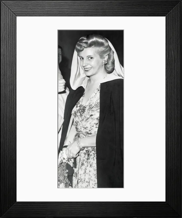 Framed Print : Eva Peron Pausing in Caped Fashion Framed Print : Eva Peron Pausing in Caped Fashion