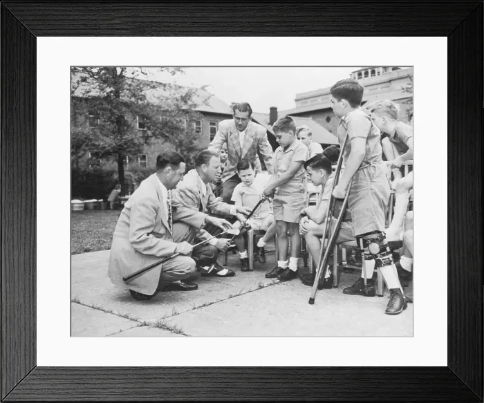Framed Print : Golf Professionals Teaching Disabled Children Framed Print : Golf Professionals Teaching Disabled Children