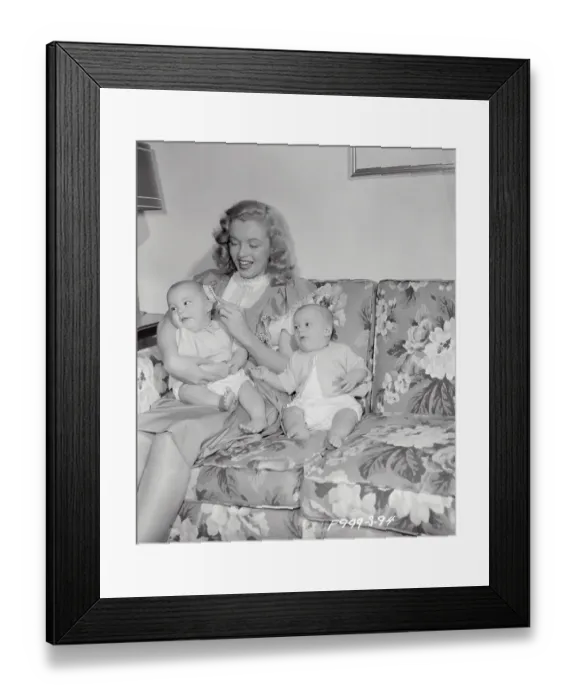Framed Print : Marilyn Monroe Sitting on Couch with Babies Framed Print : Marilyn Monroe Sitting on Couch with Babies