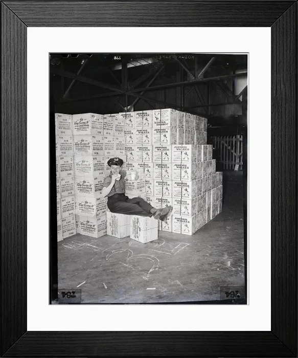 Framed Print : Guard Sits On Cases Of Whiskey Framed Print : Guard Sits On Cases Of Whiskey