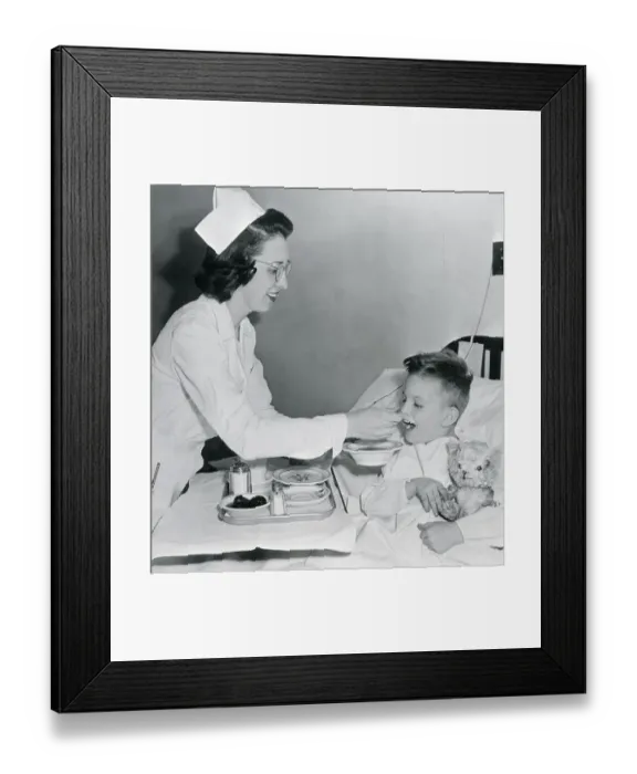 Framed Print : Nurse Feeding Boy in Bed