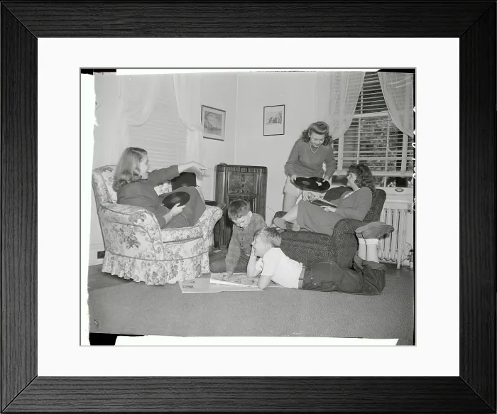 Framed Print : Girls Choosing Records with Boys Reading Comics Framed Print : Girls Choosing Records with Boys Reading Comics
