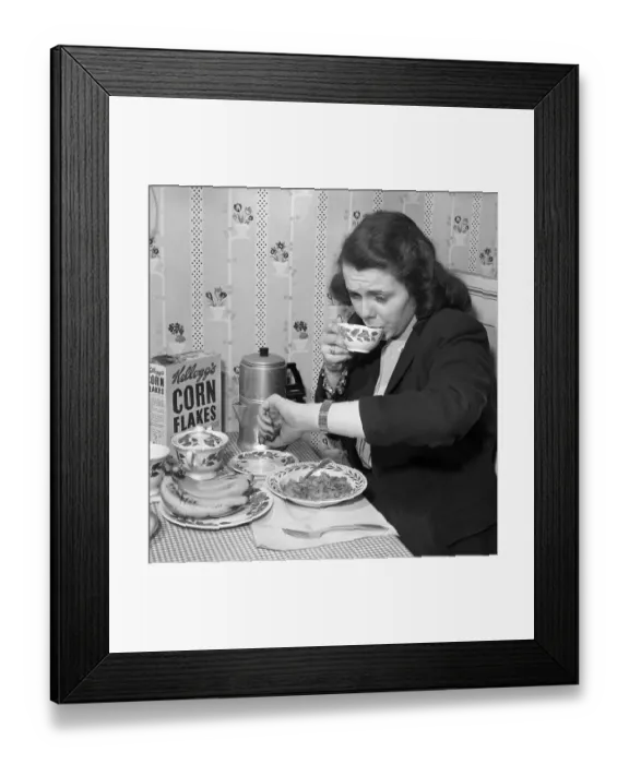 Framed Print : Woman Eating Breakfast in a Hurry Framed Print : Woman Eating Breakfast in a Hurry
