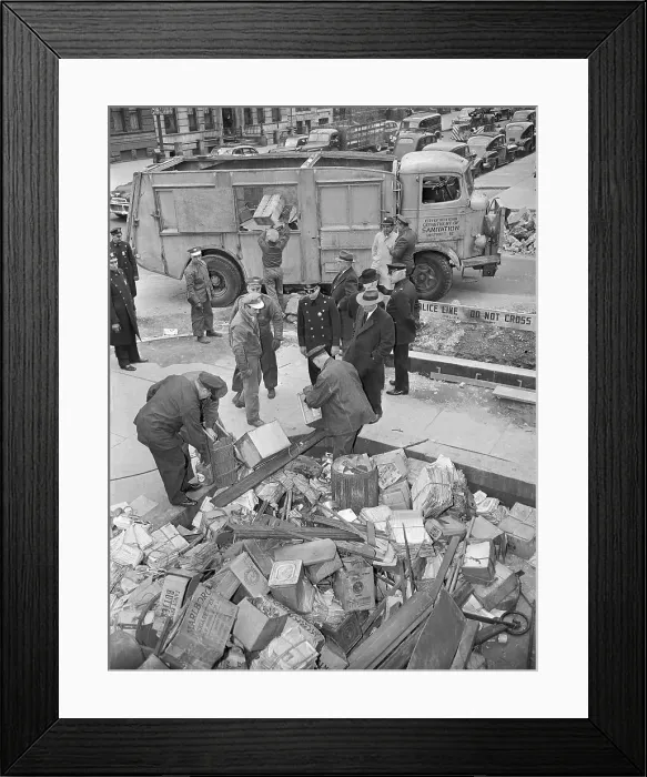 Framed Print : Policemen Dumping Items Into a Sanitation Truck Framed Print : Policemen Dumping Items Into a Sanitation Truck