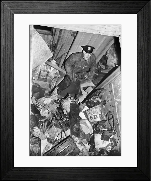 Framed Print : Policeman Searching Through Debris in Mansion Framed Print : Policeman Searching Through Debris in Mansion