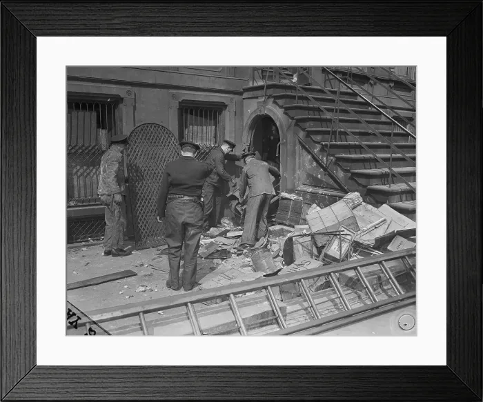 Framed Print : Policemen Trying to Enter a House Through a Basement Doorway Framed Print : Policemen Trying to Enter a House Through a Basement Doorway