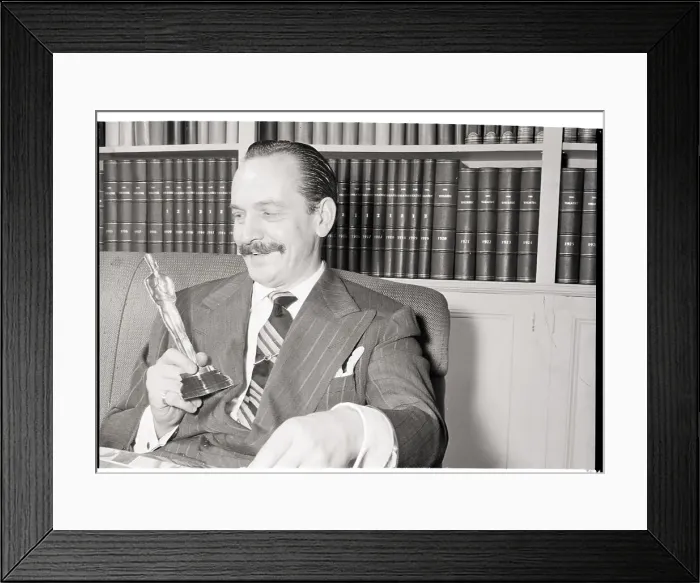 Framed Print : Frederick March Holds Cardboard Oscar