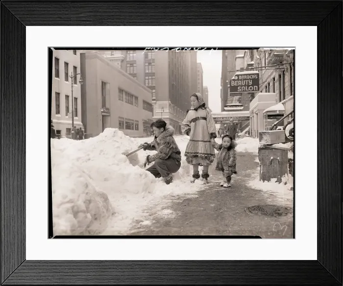 Framed Print : Man Building Snow Hut on Street Framed Print : Man Building Snow Hut on Street