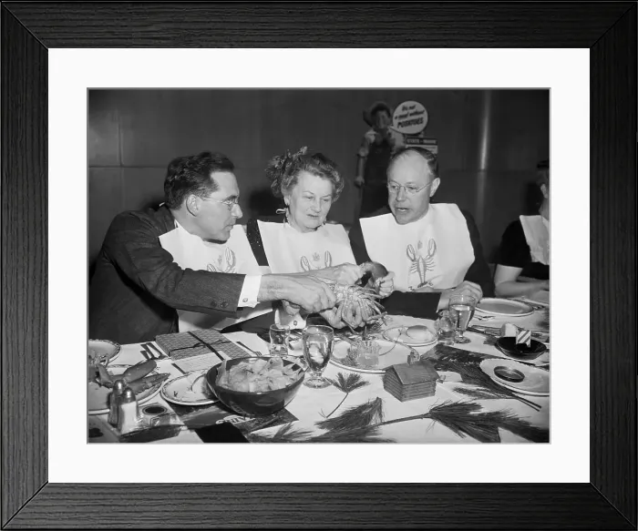 Framed Print : Man Showing Others How To Eat Lobster Framed Print : Man Showing Others How To Eat Lobster
