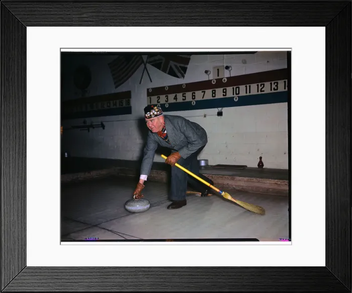 Framed Print : Man Playing the Game of Curling Framed Print : Man Playing the Game of Curling
