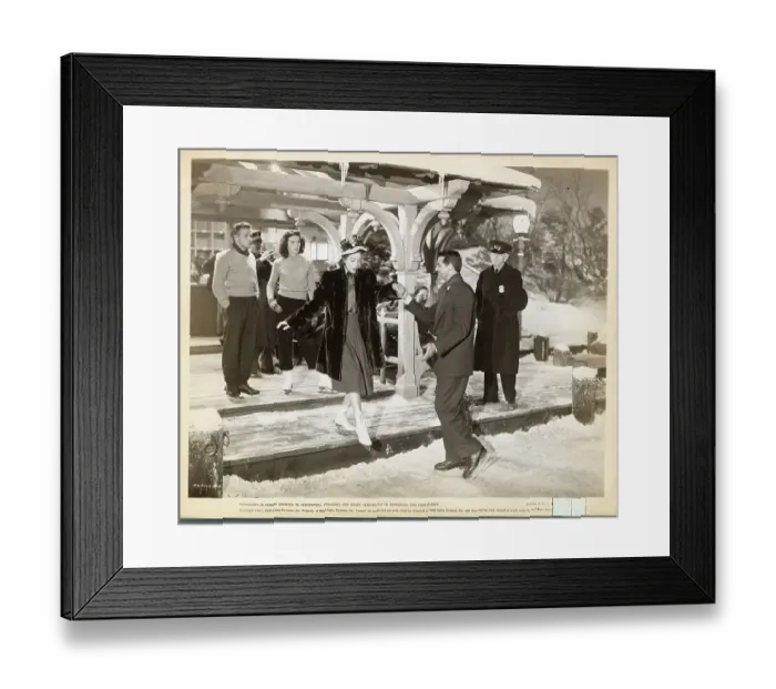 Framed Print : Cary Grant Helping Loretta Young onto Ice Rink Framed Print : Cary Grant Helping Loretta Young onto Ice Rink