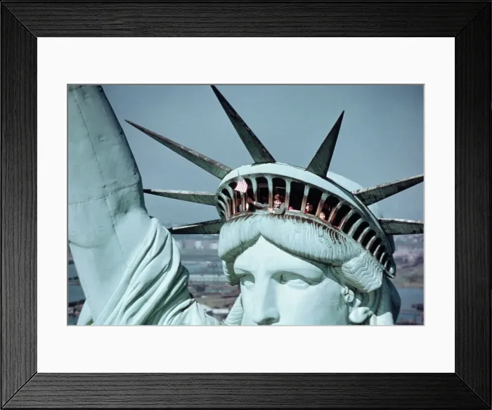Framed Print : Child Waving Flag from the Crown of the Statue of Liberty Framed Print : Child Waving Flag from the Crown of the Statue of Liberty