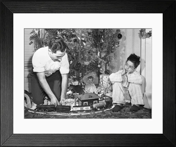 Framed Print : Boy Watches Dad Play with Train Set Framed Print : Boy Watches Dad Play with Train Set