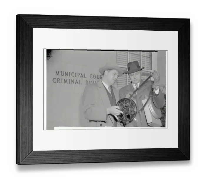Framed Print : Film Workers Looking at Roll of Film Framed Print : Film Workers Looking at Roll of Film