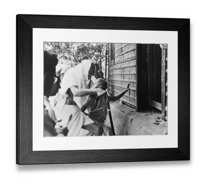 Framed Print : Monandas Gandhi Entering a House Framed Print : Monandas Gandhi Entering a House