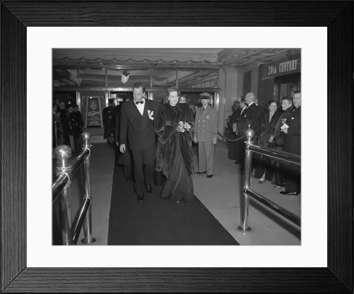 Framed Print : Star and Escort Enter Theatre for Premiere Framed Print : Star and Escort Enter Theatre for Premiere