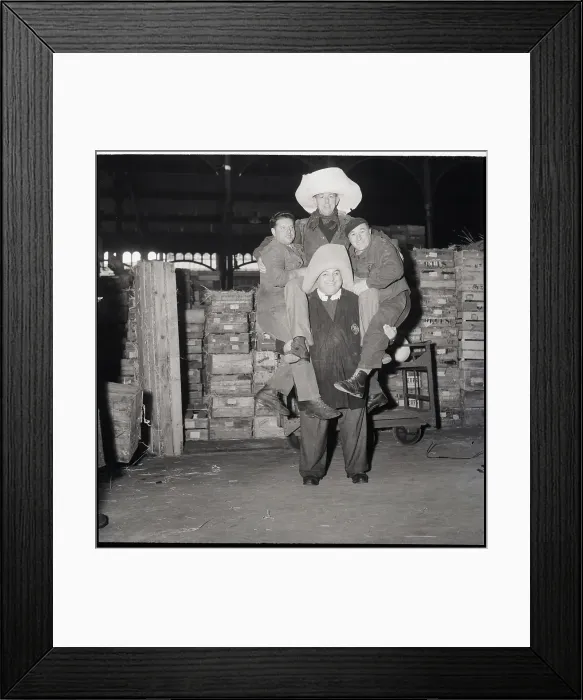 Framed Print : Husky Strongman In Hat Lifting Three Men Framed Print : Husky Strongman In Hat Lifting Three Men