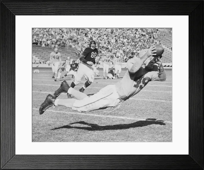 Framed Print : Jim Benton Leaping for Football Framed Print : Jim Benton Leaping for Football