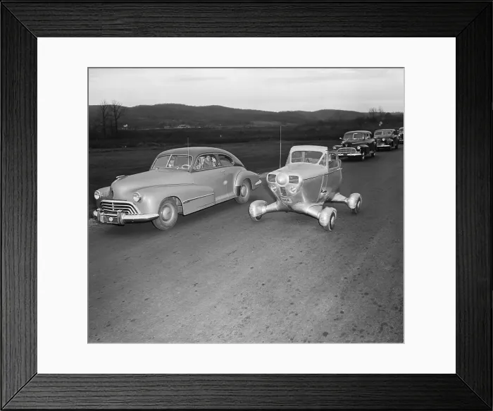 Framed Print : Experimental Vehicle Passing Cars on Highway Framed Print : Experimental Vehicle Passing Cars on Highway