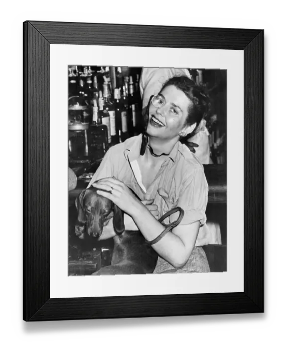 Framed Print : Woman Wearing Monocle with her Dachshund Framed Print : Woman Wearing Monocle with her Dachshund