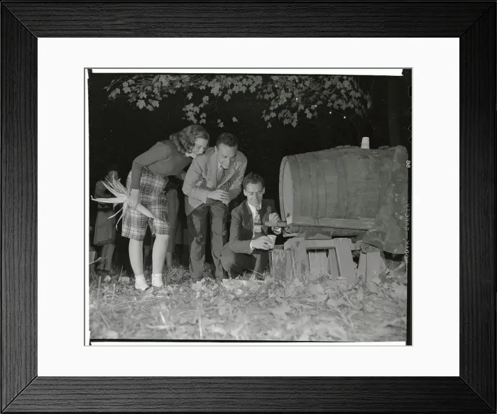 Framed Print : Man Pouring Sweet Cider from Barrel for Couple Framed Print : Man Pouring Sweet Cider from Barrel for Couple