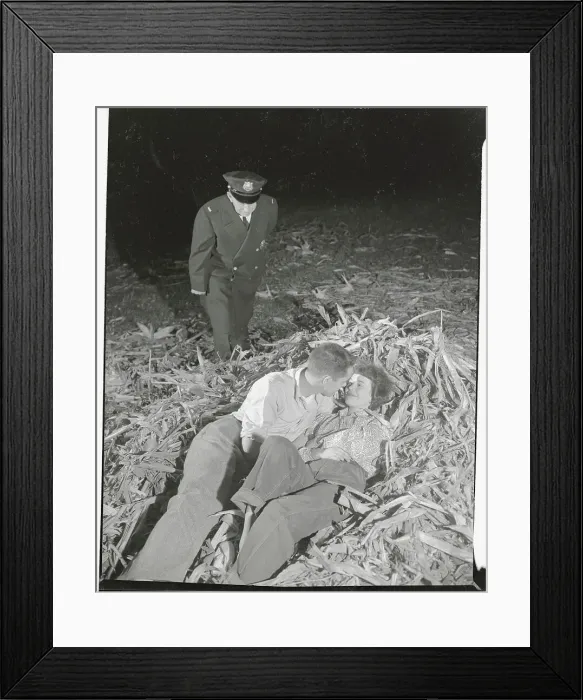 Framed Print : Policeman Catching Couple Laying in Corn Husks Framed Print : Policeman Catching Couple Laying in Corn Husks