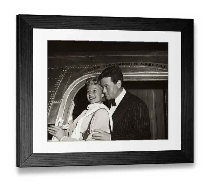 Framed Print : Orson Welles and Rita Hayworth Posing at Airplane Doorway Framed Print : Orson Welles and Rita Hayworth Posing at Airplane Doorway