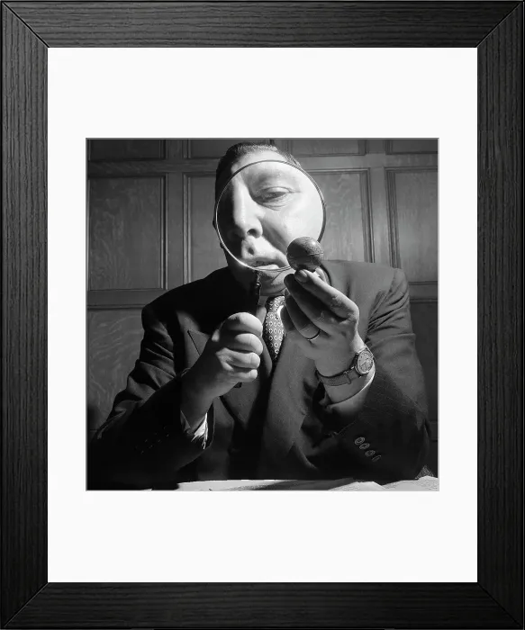 Framed Print : Looking At Globe with Magnifying Glass Framed Print : Looking At Globe with Magnifying Glass