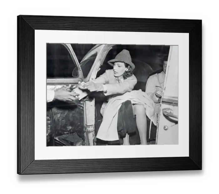 Framed Print : Actress Greta Garbo Paying Her Porter from Taxi Framed Print : Actress Greta Garbo Paying Her Porter from Taxi