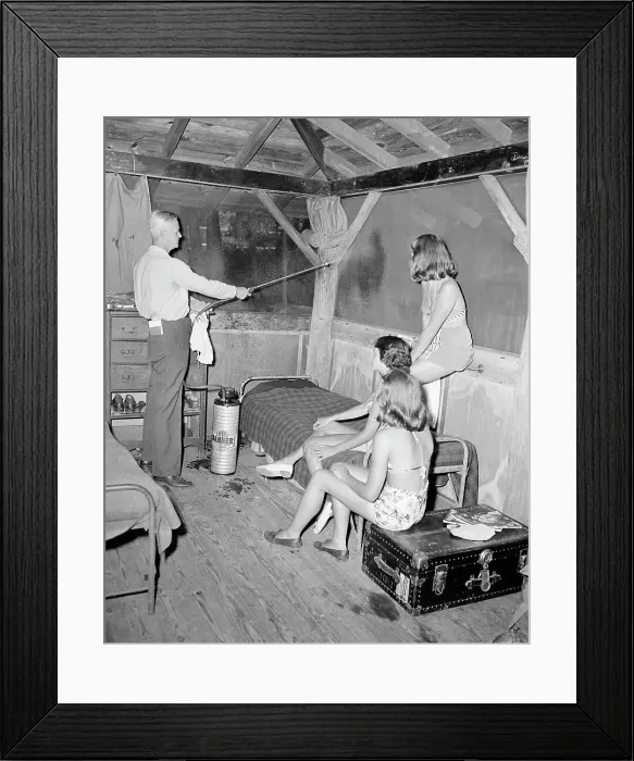 Framed Print : Dr. Spraying Camp Building With Ddt Framed Print : Dr. Spraying Camp Building With Ddt
