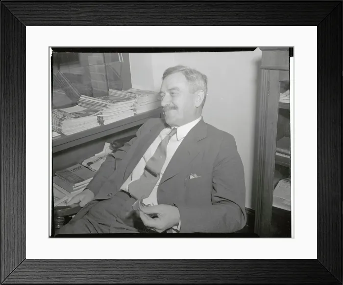 Framed Print : Earl Browder Leaning Back in Chair and Holding Eyeglasses Framed Print : Earl Browder Leaning Back in Chair and Holding Eyeglasses