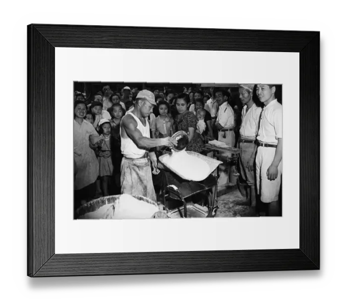 Framed Print : Workman Measures Food Ration For Woman Framed Print : Workman Measures Food Ration For Woman