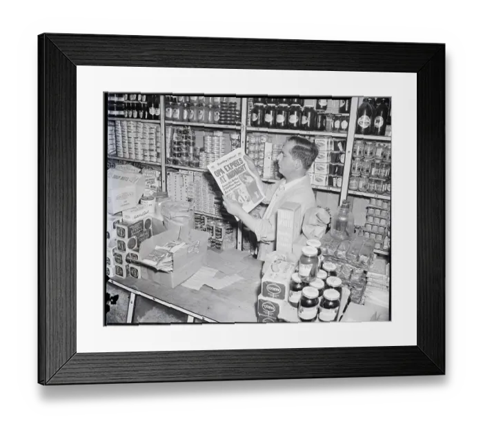Framed Print : Merchant Reading Price Change In Paper Framed Print : Merchant Reading Price Change In Paper