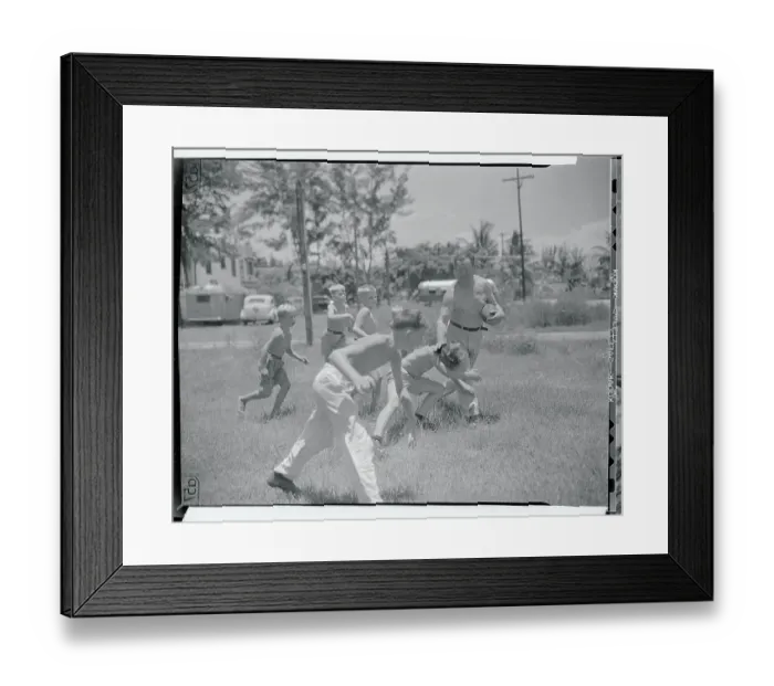 Framed Print : Jim Thorpe Playing Football with Children Framed Print : Jim Thorpe Playing Football with Children
